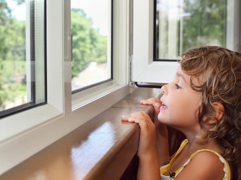 girl looking out window