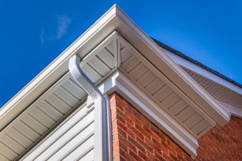 close,up,of,white,frame,gutter,guard,system,,eaves,through,