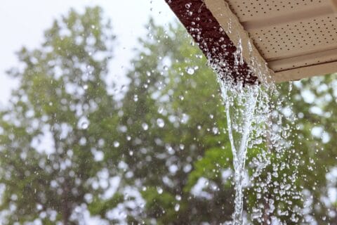 during,heavy,rain,,water,comes,from,over,gutters